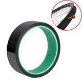a black and green ring with a green glow