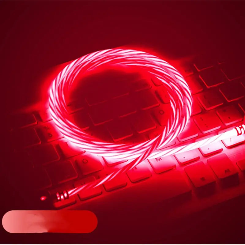a red neon light on a laptop keyboard