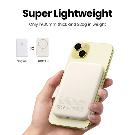 Lightweight magnetic wireless power bank attached to a yellow smartphone.