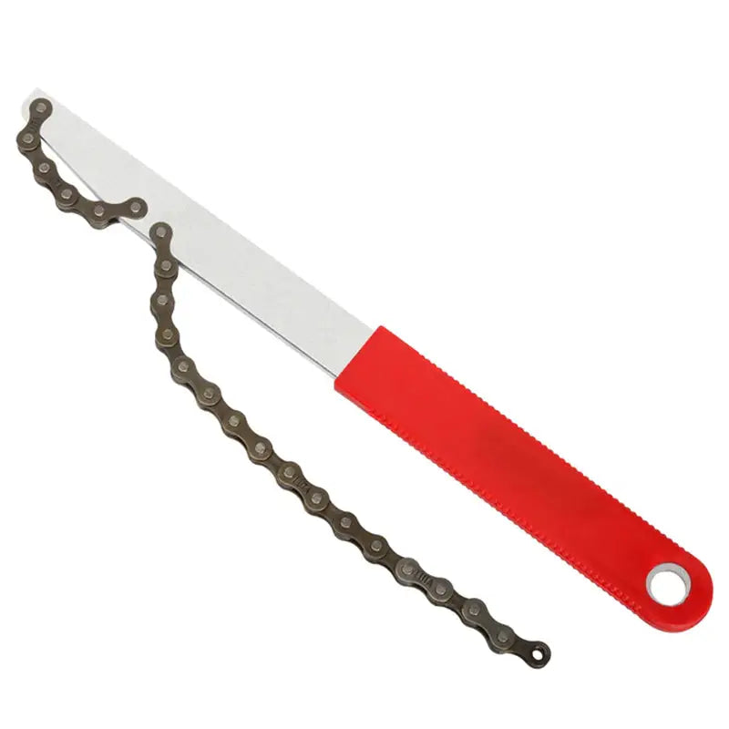 a red and black knife with a chain