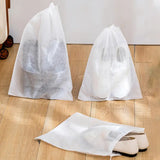 two bags of white paper on the floor