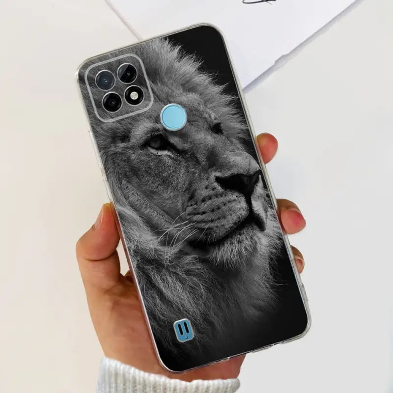 a person holding a phone case with a lion face