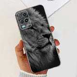 a hand holding a phone case with a black and white lion