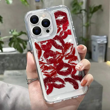 a woman holding a red phone case with red lipstick on it