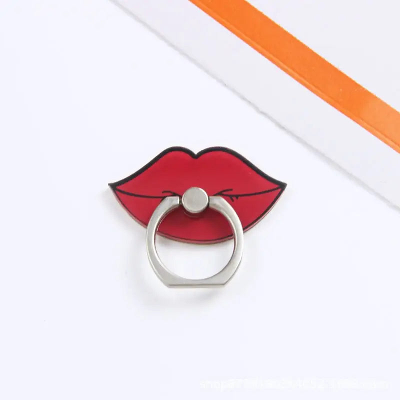 a red lipstick ring with a white background