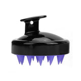 a black and purple brush with spikes