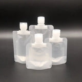 a set of six clear plastic bottles with white caps