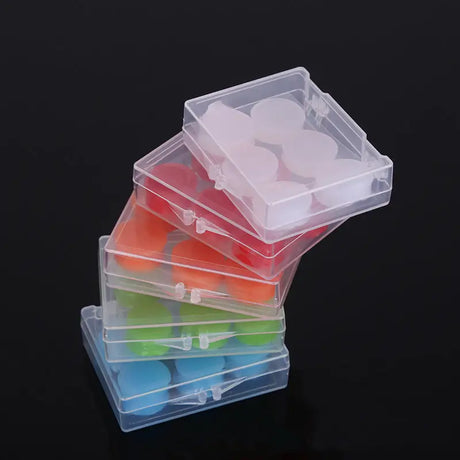 a stack of plastic boxes with different colored lids