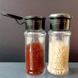 two glass jars with red and white beans in them