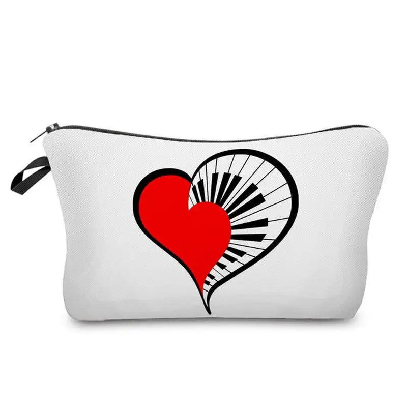 a white zipper bag with a red heart and piano keys