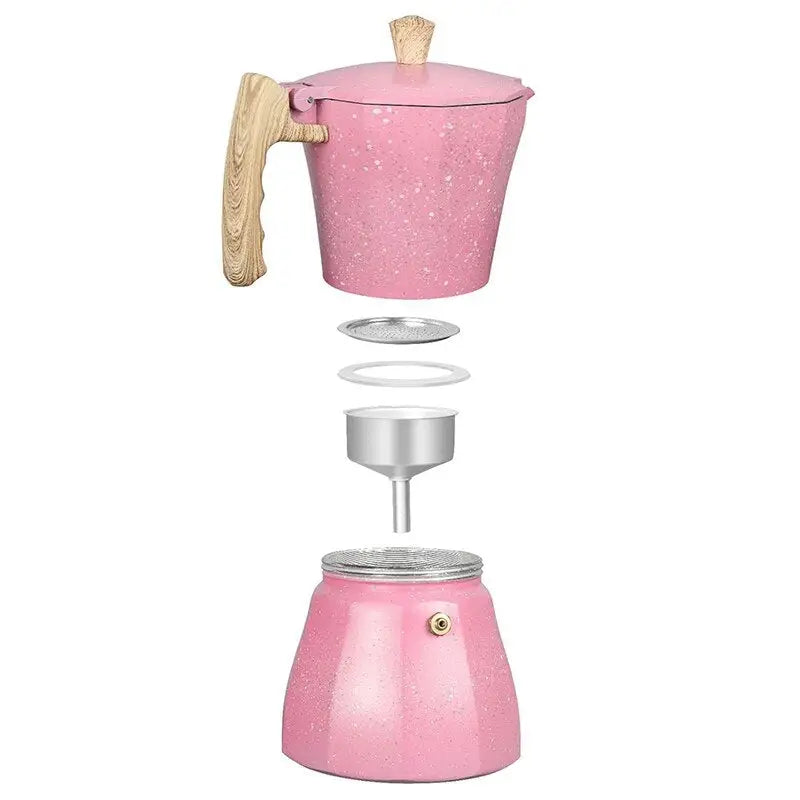 a pink coffee maker with a wooden handle