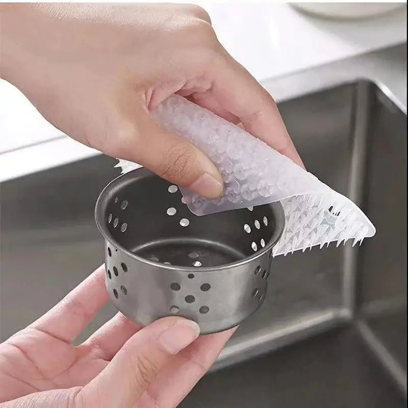 a person is putting a napkin into a sink