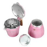 there is a pink pot with a lid and a strainer