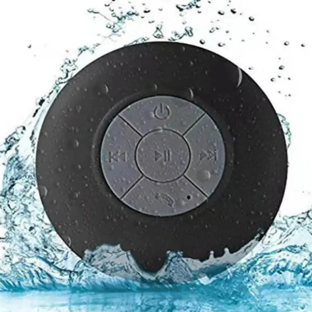 the waterproof bluetooth speaker is shown in the water