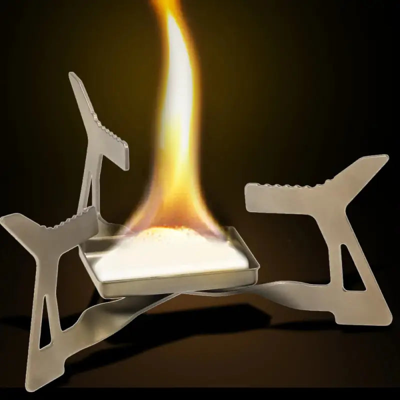 a burning paper sculpture of a man on a laptop