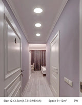 a long hallway with white walls and white trim