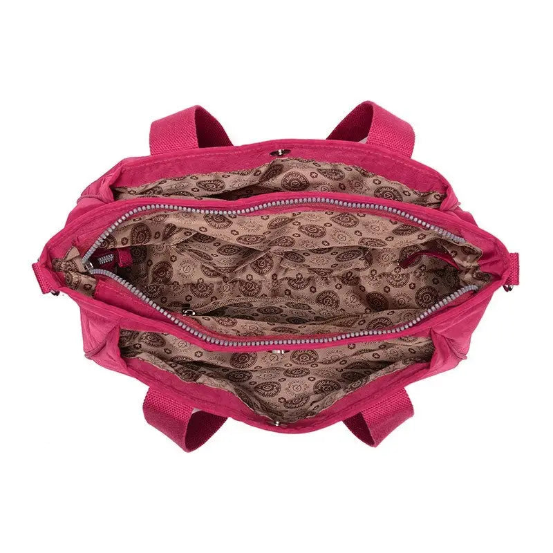 the pink and brown paisley print backpack