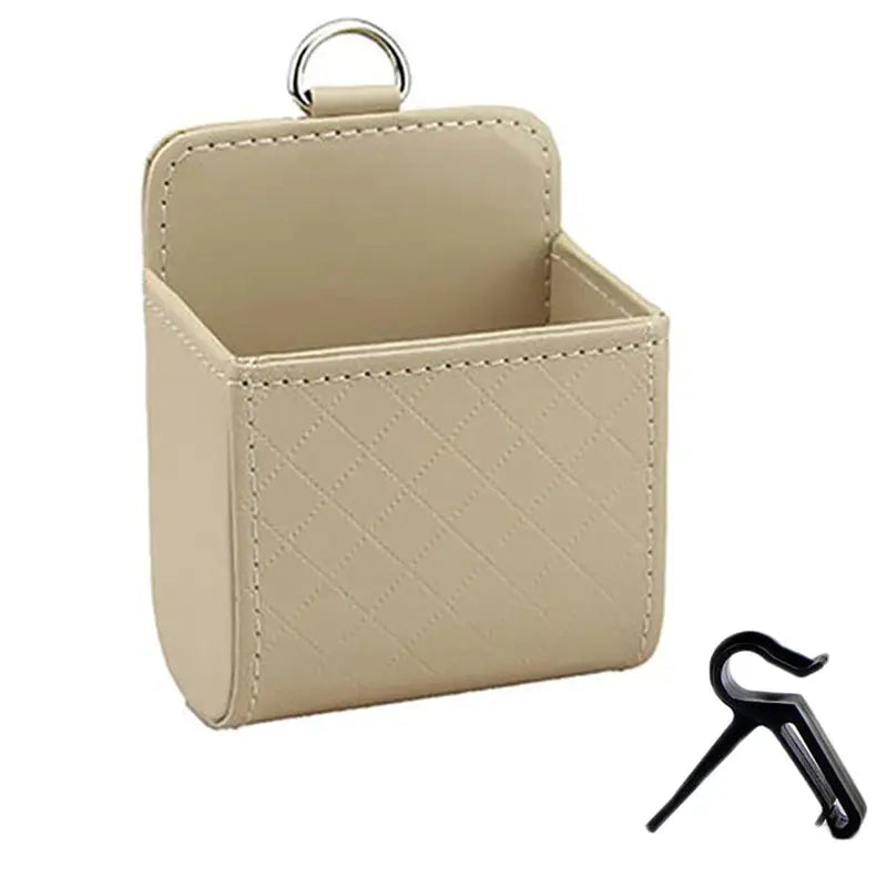 a beige leather storage box with a key