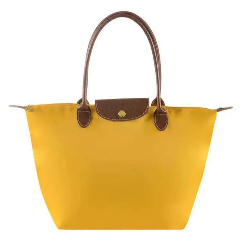 a yellow tote bag with brown handles