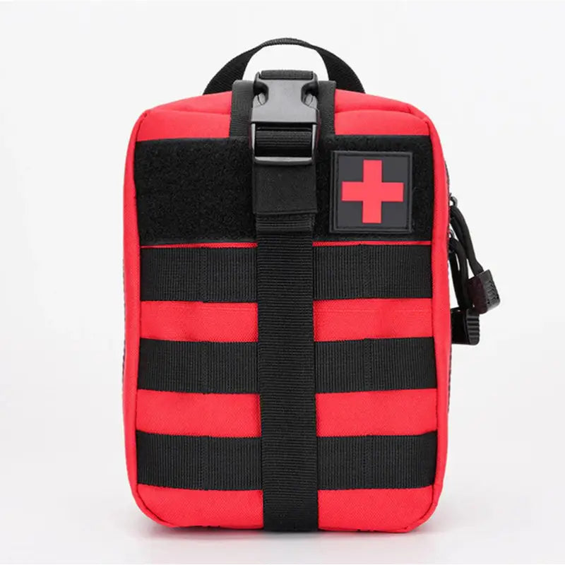 a red cross bag with black straps