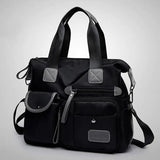 a black handbag with a zipper closure