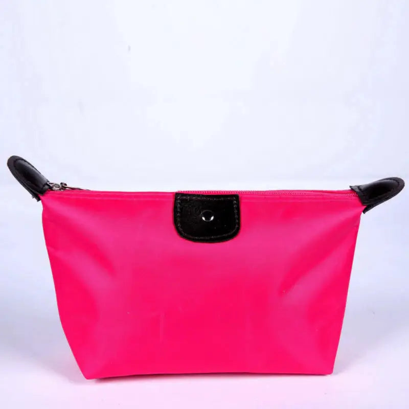 a pink cosmetic bag with black handles