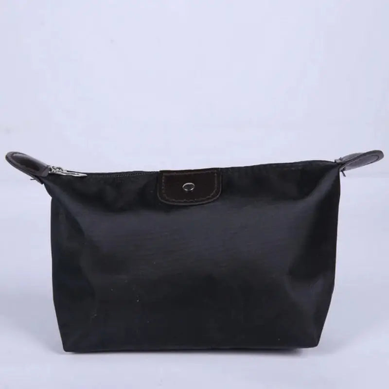 a black leather bag with a zipper