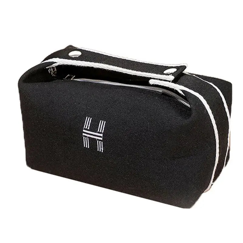the black cosmetic bag with white stripes