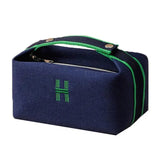 the blue and green lunch bag is shown with a zipper closure