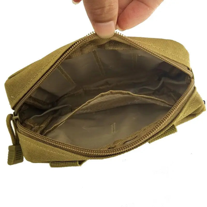 a hand holding a small pouch with a zipper