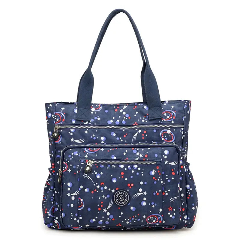 a navy blue and white bag with planets and stars