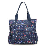 a navy blue and white bag with planets and stars