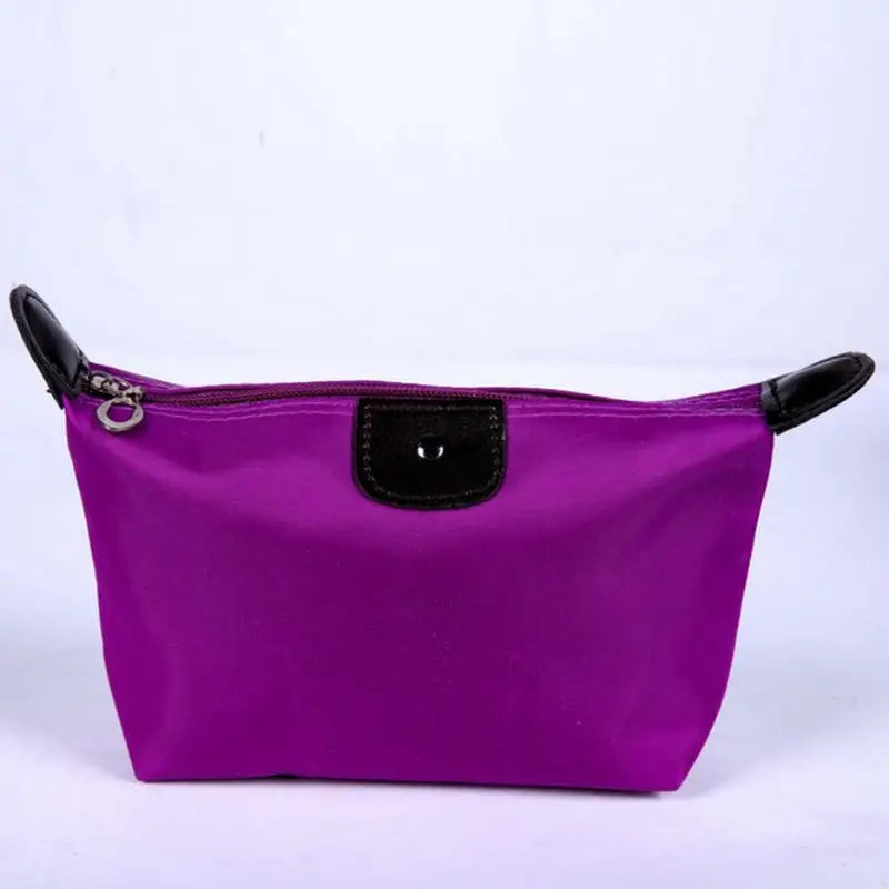 a purple cosmetic bag with black handles