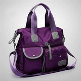 a purple purse with a purple handle