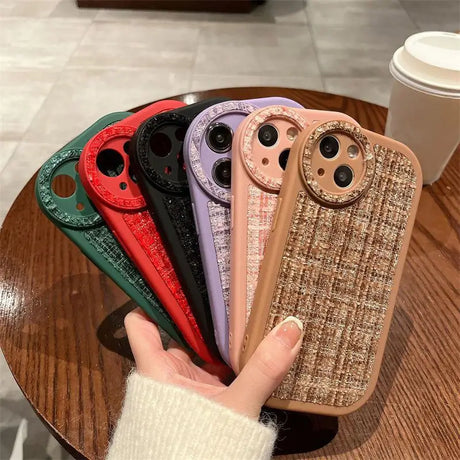 a woman holding a phone case with a pattern on it