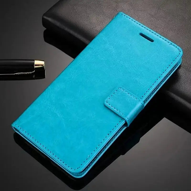 a blue leather case with a pen and a pen