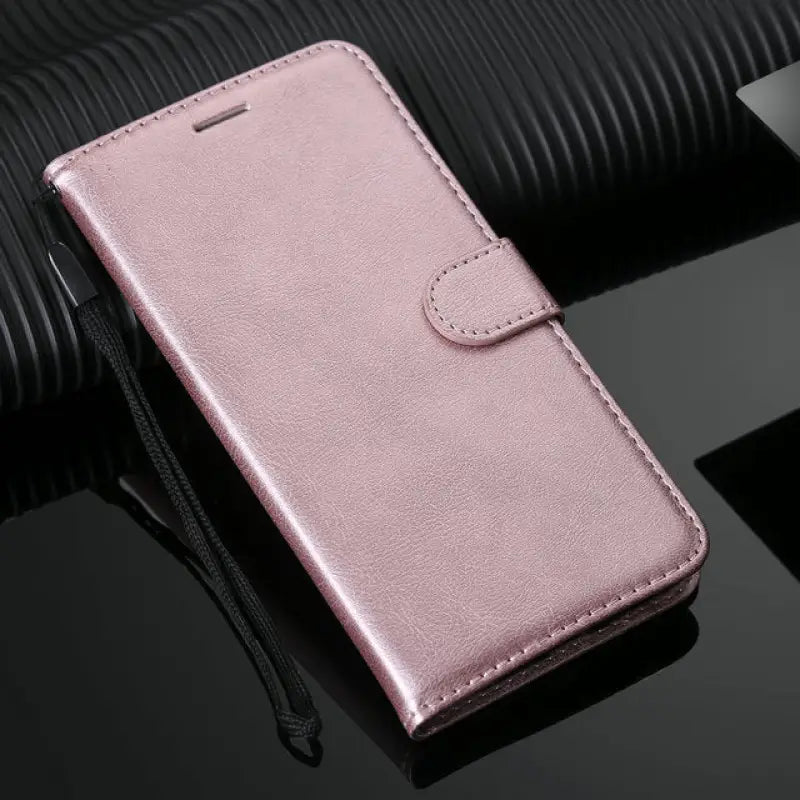 a pink leather wallet case with a zipper