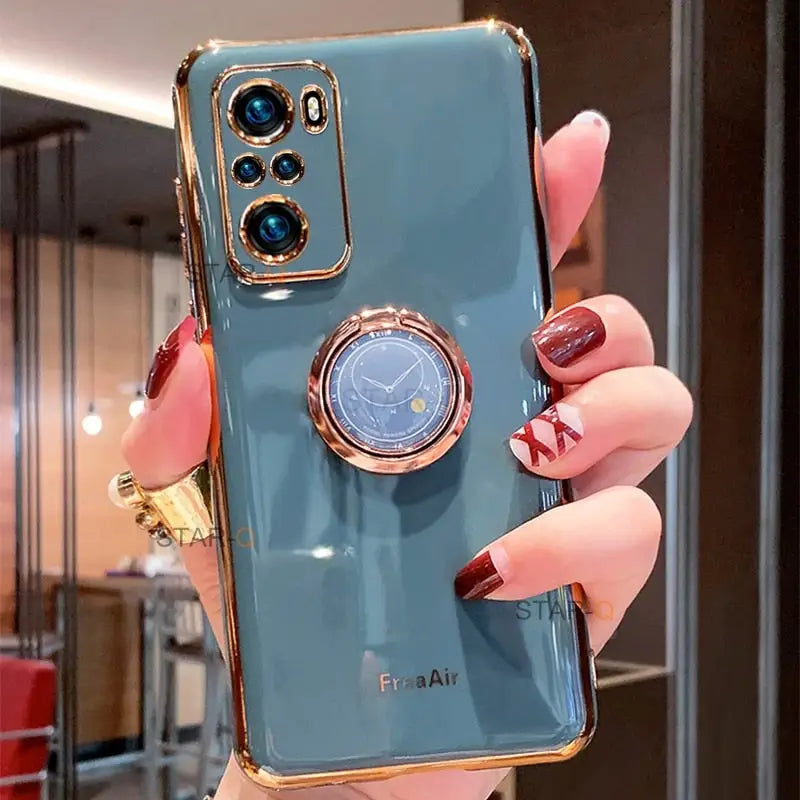 a woman holding a blue phone case with a watch on it