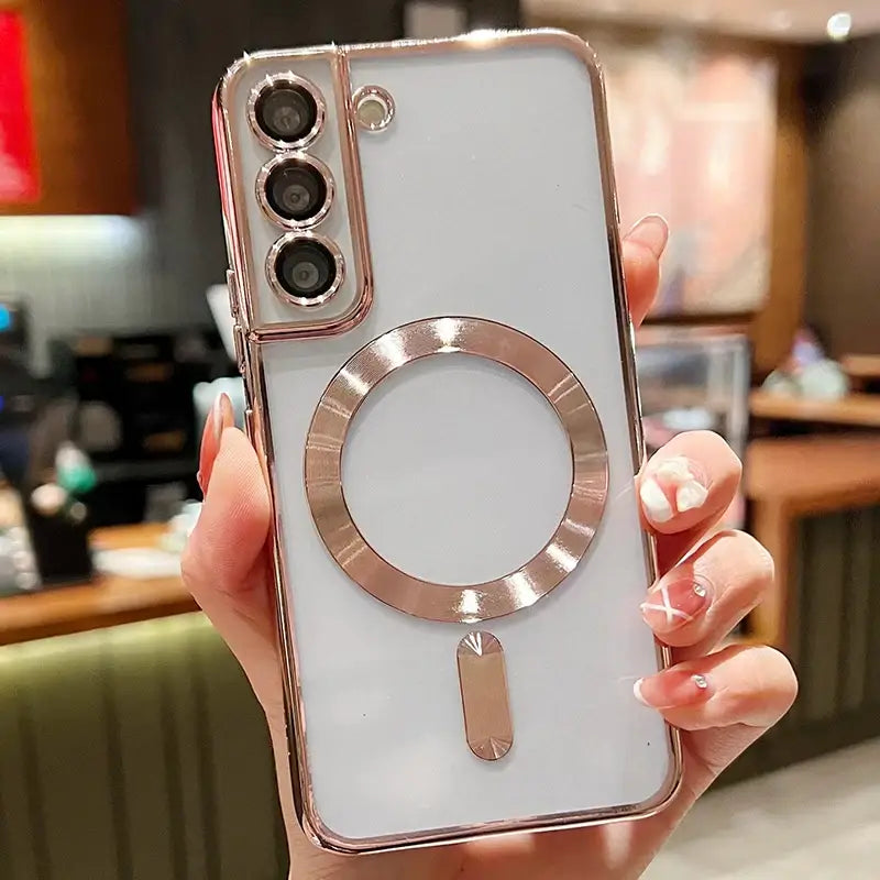 a woman holding a white iphone case with a ring on it