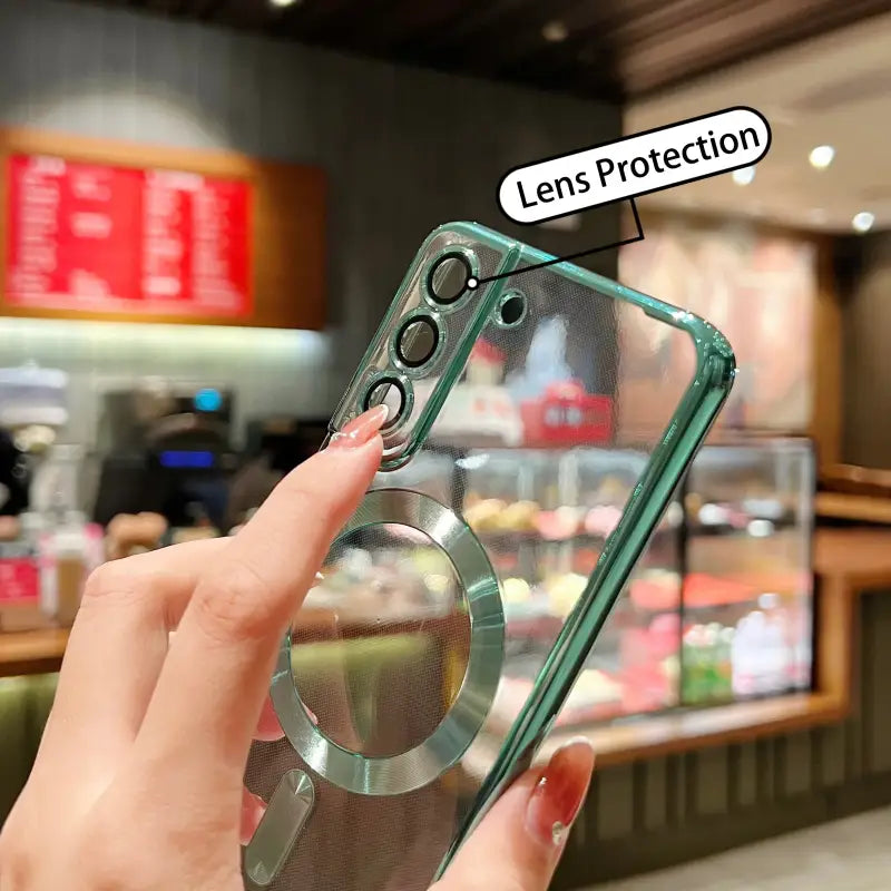 a person holding a phone with a lens