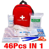 a first aid kit with a red bag and scissors