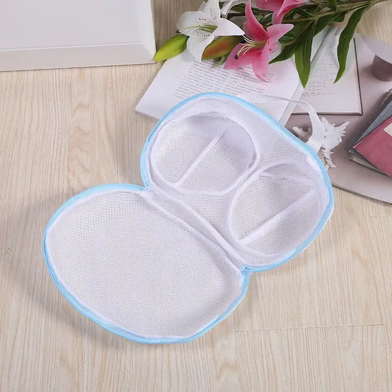 a pair of white and blue eye masks on a wooden floor