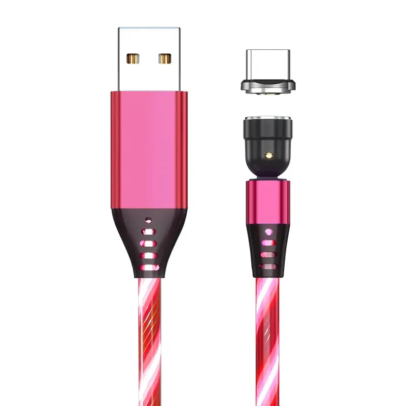 a close up of a pink and black cable connected to a charger