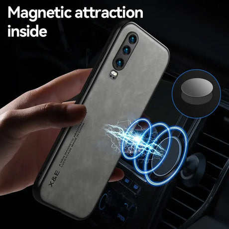 a person holding a phone with a magnet attached to it