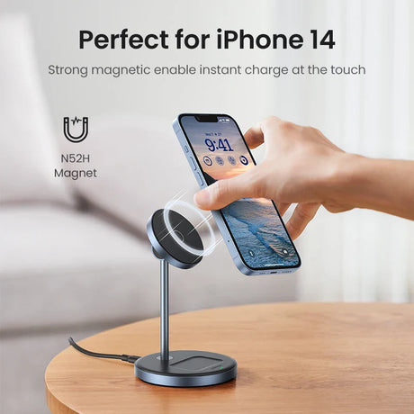 Magnetic charging stand for iPhone 14 with an adjustable arm and circular charging pad.