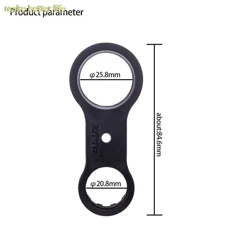 a black bottle opener with a white background