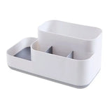 a white plastic box with two compartments