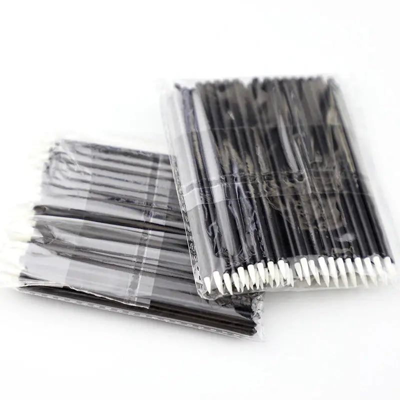a close up of a bunch of black and white straws