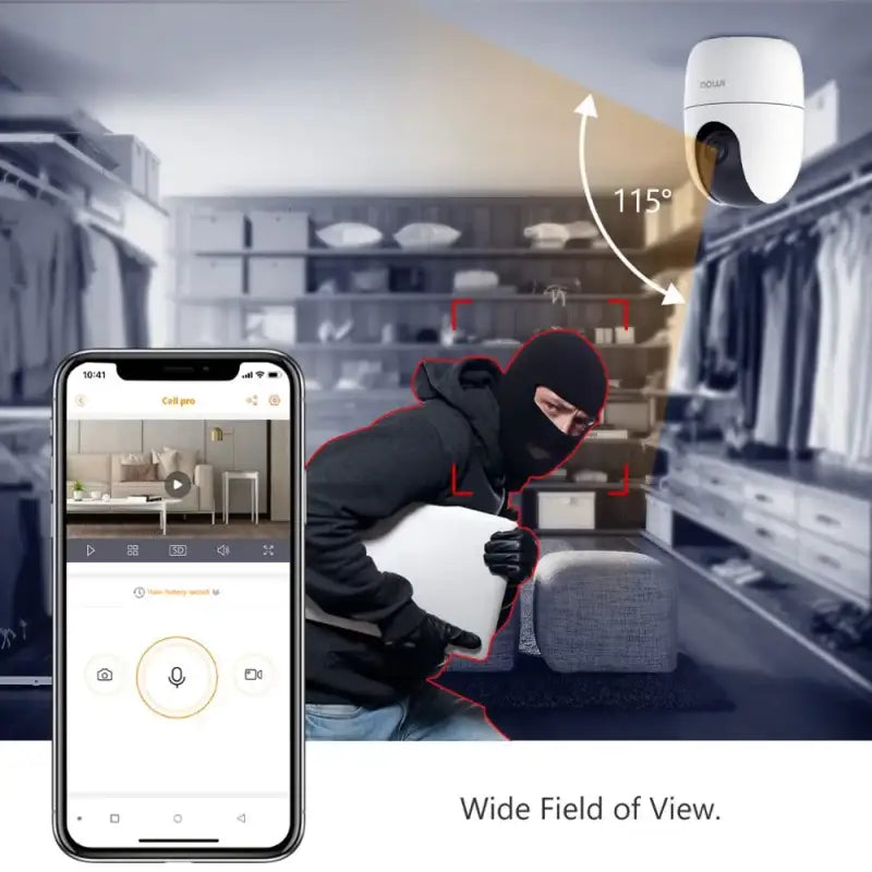 a man in a black hood and hoodie is using a smartphone to scan a home security camera