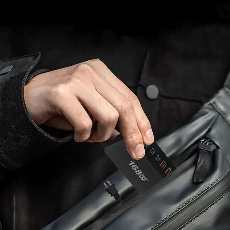 a man holding a black leather bag